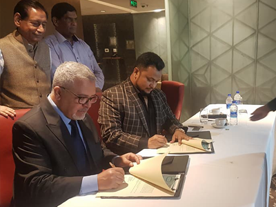 Signing between  president, Mecca Cola, France and Dr. Kamrul Ahsan witnessed by H N Ashequr Rahman, MP, Chairman-Meghna Bank Ltd and Mr. Benzir Ahmed, MP, President- BAIRA